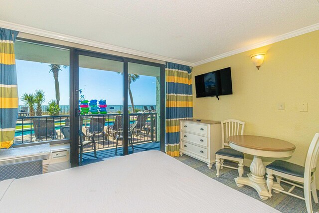 bedroom with crown molding, access to outside, and a textured ceiling