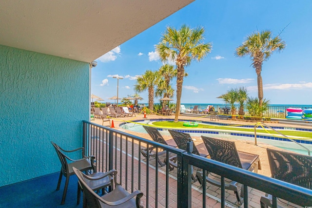 balcony featuring a water view