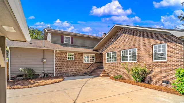7602 Glenwood Dr, Myrtle Beach, SC 29572 - back of property featuring crawl space, brick siding, a patio, and roof with shingles