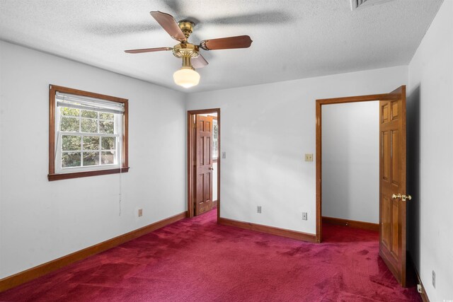 7602 Glenwood Dr, Myrtle Beach, SC 29572 - unfurnished bedroom featuring carpet floors, a textured ceiling, and a ceiling fan