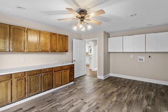 7602 Glenwood Dr, Myrtle Beach, SC 29572 - kitchen featuring brown cabinets, a ceiling fan, dark wood-style floors, and light countertops