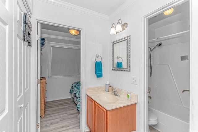 4516 Seaview St Unit 135, North Myrtle Beach, SC 29582 - full bathroom featuring vanity, crown molding, wood finished floors, and washtub / shower combination
