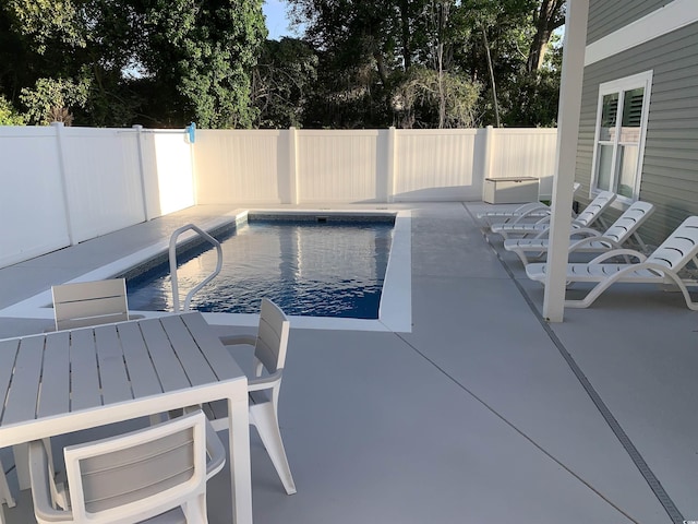 223 S 9th Ave S, North Myrtle Beach, SC 29582 - view of swimming pool featuring a patio, a fenced backyard, and outdoor dining area