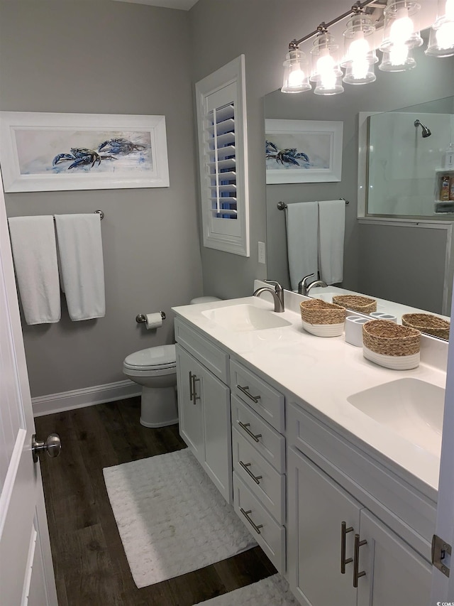 223 S 9th Ave S, North Myrtle Beach, SC 29582 - bathroom featuring a stall shower, double vanity, and wood finished floors