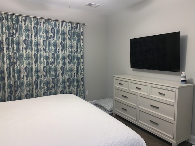 223 S 9th Ave S, North Myrtle Beach, SC 29582 - bedroom featuring dark wood-style flooring and baseboards