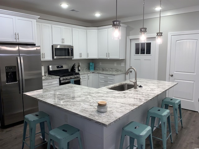 223 S 9th Ave S, North Myrtle Beach, SC 29582 - kitchen featuring appliances with stainless steel finishes, dark wood-type flooring, white cabinets, light stone counters, and recessed lighting