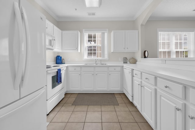 kitchen with light tile patterned flooring, a sink, white appliances, white cabinetry, and visible vents