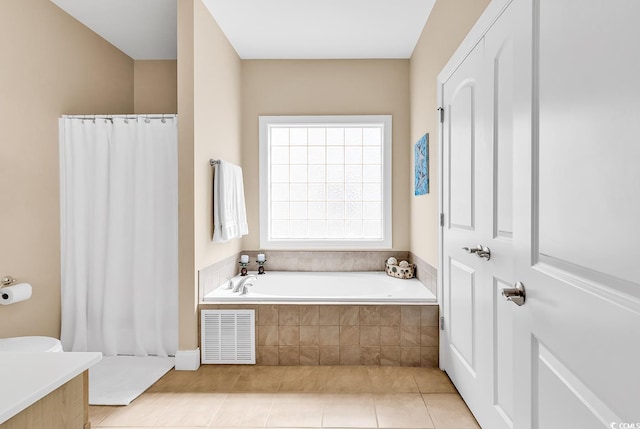 full bath with tile patterned floors, a garden tub, curtained shower, and visible vents