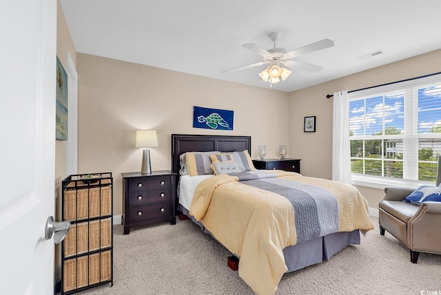 bedroom with light colored carpet, baseboards, and visible vents