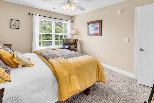 bedroom with carpet floors, a ceiling fan, baseboards, and visible vents
