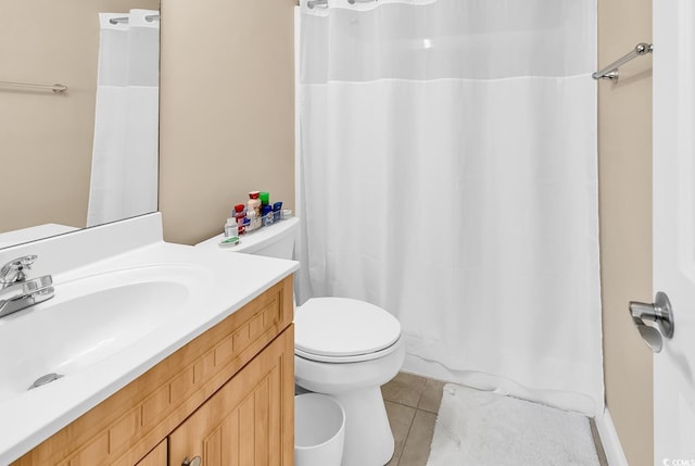 bathroom featuring tile patterned flooring, a shower with curtain, toilet, and vanity