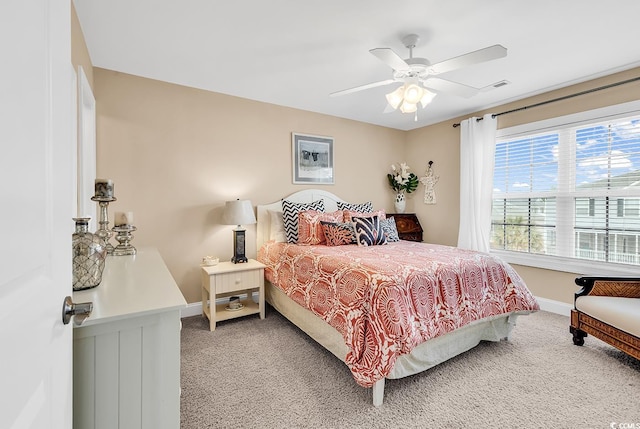 bedroom featuring a ceiling fan, baseboards, visible vents, and carpet