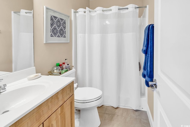 bathroom with vanity, tile patterned floors, toilet, and curtained shower