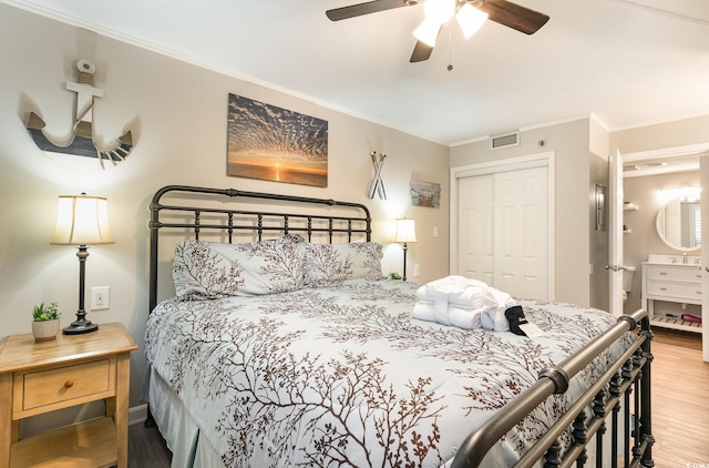 5523 N Ocean Blvd Unit 1201, Myrtle Beach, SC 29577 - bedroom featuring a closet, wood finished floors, ornamental molding, and a ceiling fan