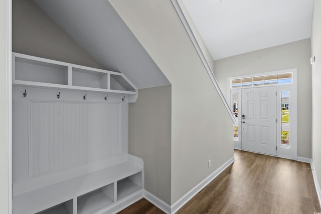mudroom with baseboards, vaulted ceiling, and wood finished floors