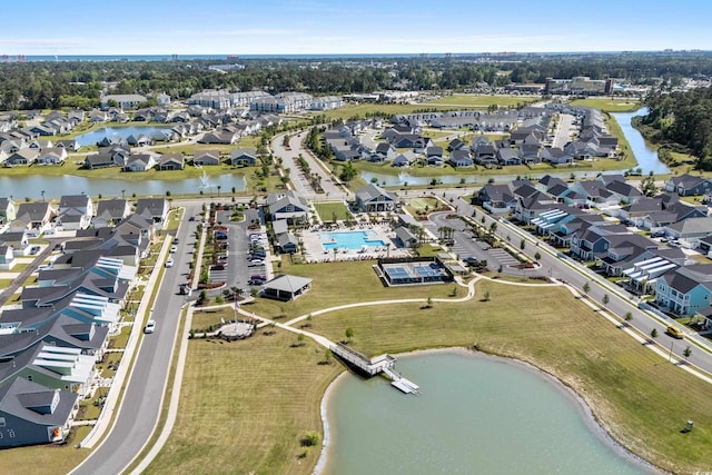 bird's eye view featuring a residential view and a water view