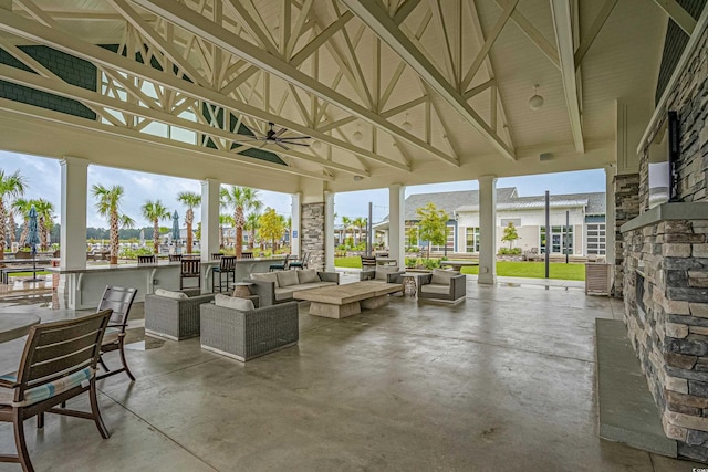 exterior space with a ceiling fan and an outdoor living space