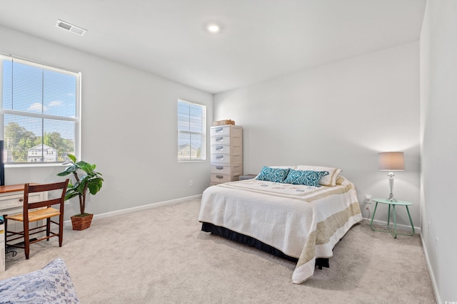 3968 Hibiscus Dr, Little River, SC 29566 - carpeted bedroom featuring multiple windows, baseboards, and a desk