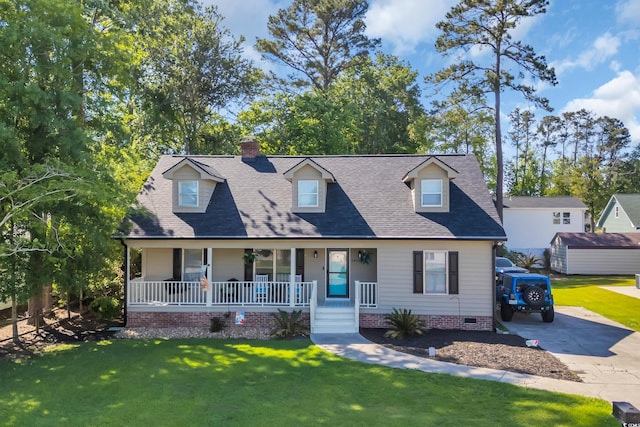 cape cod house with a chimney, a front yard, a porch, and crawl space