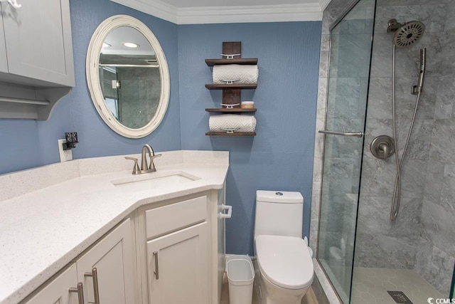 full bath featuring vanity, ornamental molding, a stall shower, and toilet
