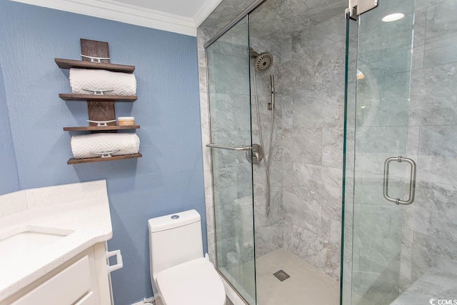 bathroom with crown molding, a stall shower, toilet, and vanity