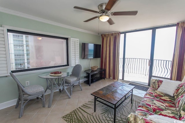 living room featuring crown molding, baseboards, a ceiling fan, and light tile patterned flooring