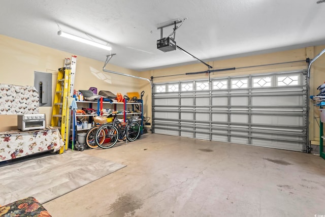 garage featuring a garage door opener and electric panel