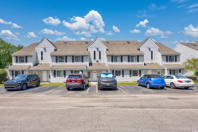 view of property with uncovered parking