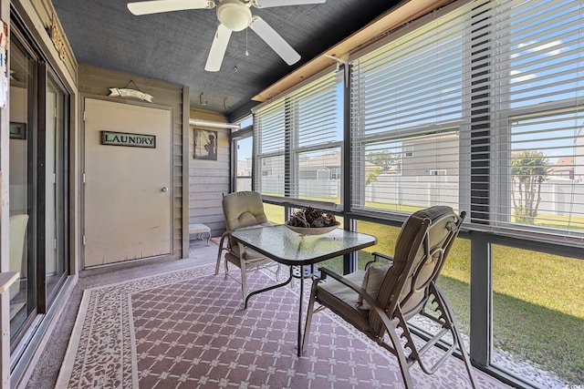 sunroom with a ceiling fan