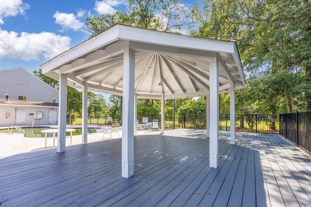 deck featuring a gazebo and fence