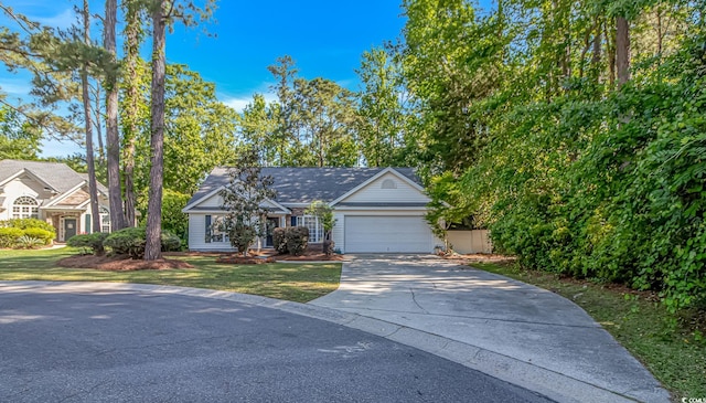 ranch-style house featuring concrete driveway, a front yard, and a garage
