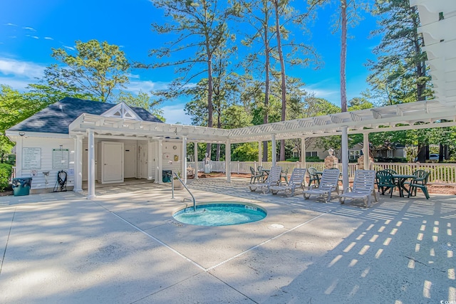 view of pool with a community hot tub, a patio area, fence, and a pergola