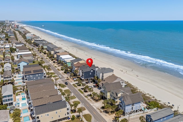 aerial view with a view of the beach and a water view