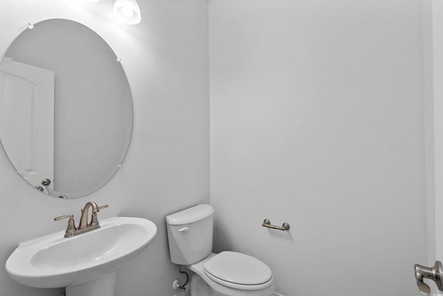 bathroom with a sink and toilet