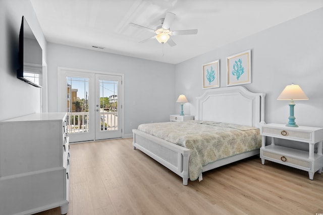 bedroom with a ceiling fan, french doors, visible vents, access to exterior, and light wood-type flooring