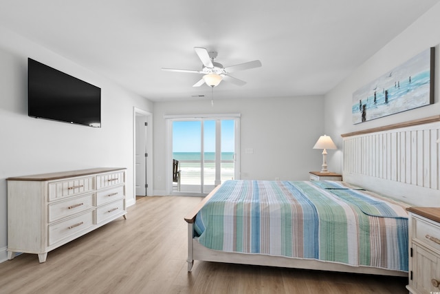 bedroom featuring baseboards, access to outside, light wood finished floors, and ceiling fan