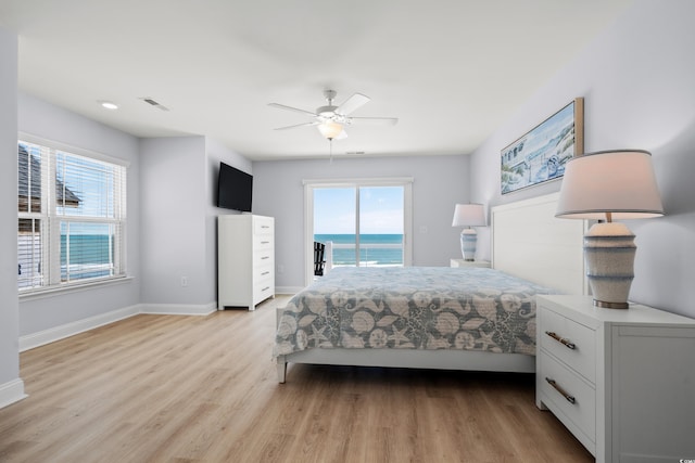 bedroom featuring visible vents, baseboards, access to outside, a ceiling fan, and light wood finished floors