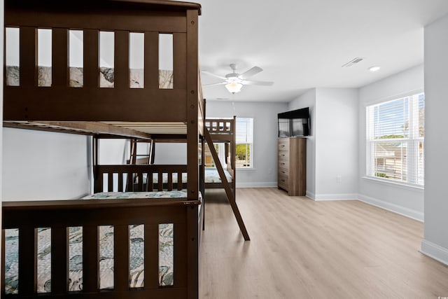 unfurnished bedroom with baseboards and wood finished floors