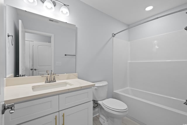 bathroom with toilet, visible vents, bathing tub / shower combination, and vanity