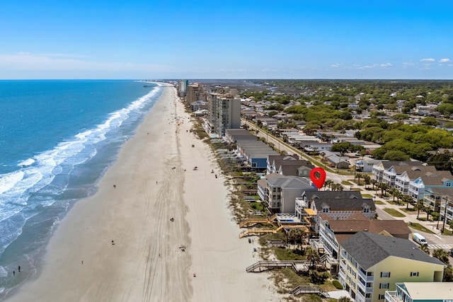 birds eye view of property featuring a view of the beach and a water view