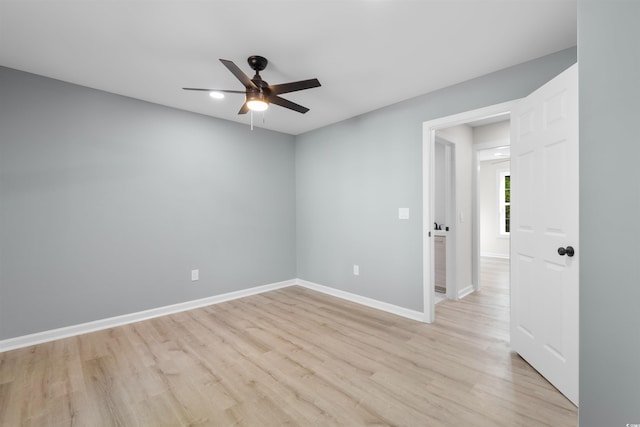 spare room featuring light wood-type flooring, baseboards, a ceiling fan, and recessed lighting