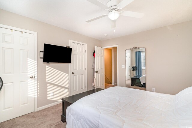 bedroom featuring carpet floors, a ceiling fan, and baseboards