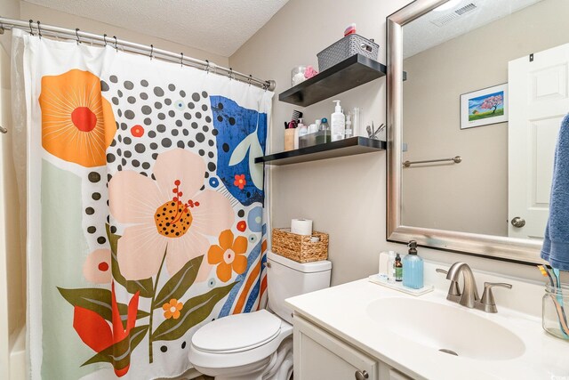 bathroom featuring vanity, toilet, a textured ceiling, curtained shower, and visible vents
