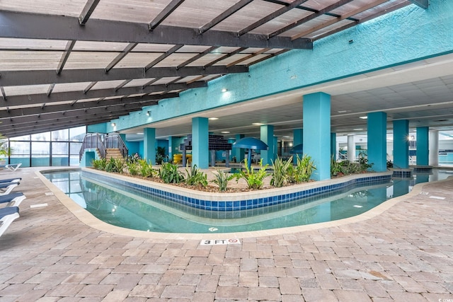 community pool with a patio area