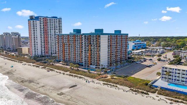 bird's eye view featuring a view of the beach and a water view