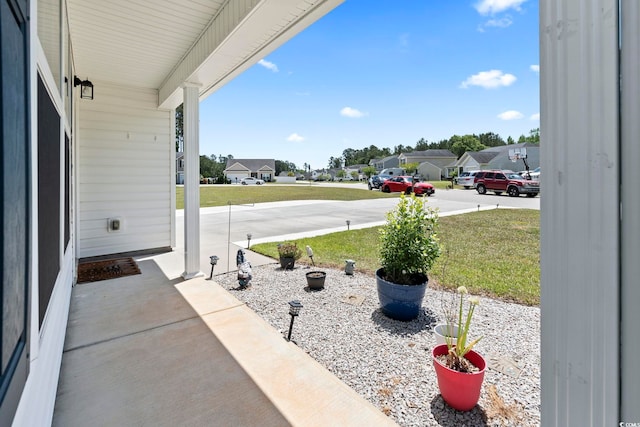 109 Winding Path Dr, Loris, SC 29569 - covered porch with a residential view and a lawn