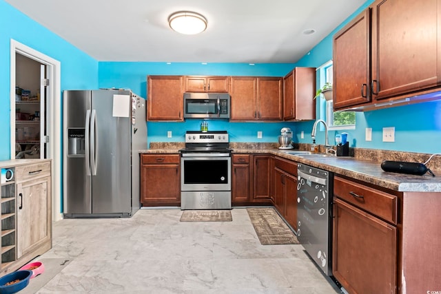 109 Winding Path Dr, Loris, SC 29569 - kitchen featuring appliances with stainless steel finishes, a sink, and brown cabinetry