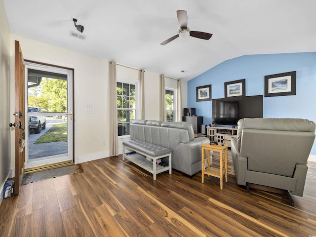 living room with visible vents, dark wood finished floors, a ceiling fan, baseboards, and vaulted ceiling