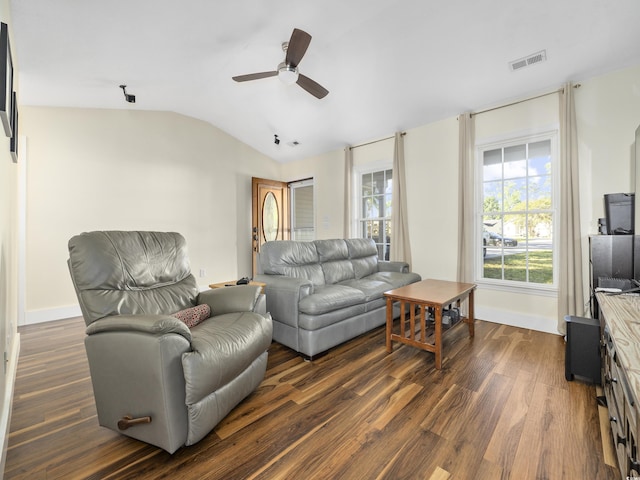 living room with ceiling fan, visible vents, dark wood finished floors, baseboards, and lofted ceiling