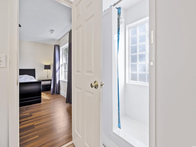 hall featuring wood finished floors